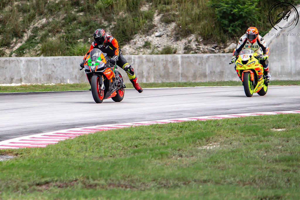 Why racers dangle their leg when they are braking?