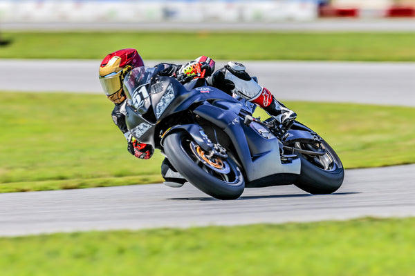 Honda CBR600RR race bike with the WSBK style headlight decals fitted, customer photo taken on track